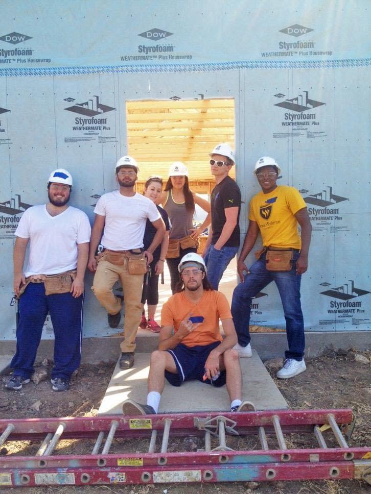 Photo courtesy of Scott Anderson. The Wesleyan chapter of Habitat for Humanity works on homes for the community. From left to right: Scott Anderson, Aaron Benavides, Debora Sainz, Sidney Mitchell, Forrest Kneten and Michael Thomas. Sitting is Philip Trammell.