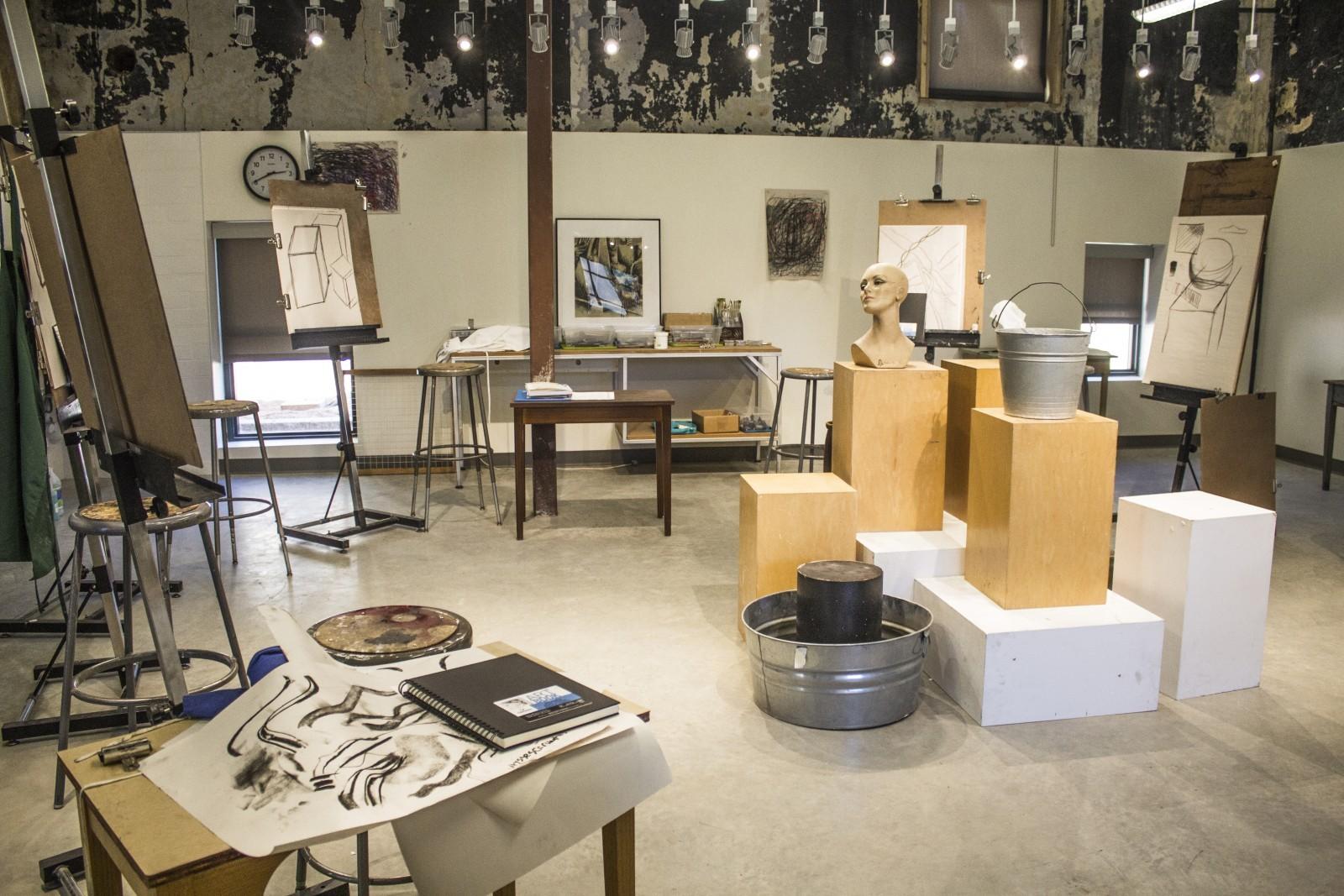 The main room in the Polytechnic Firehouse, now housing the art classes, used to hold the fire department's horses.