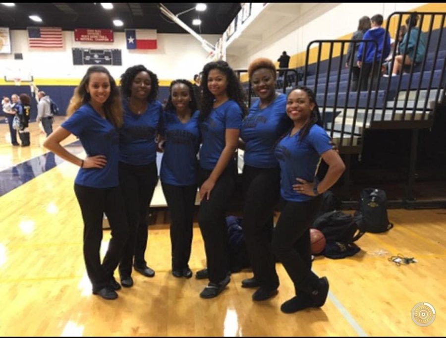 Returning dancers Taylor Tyler (second from left) and Arlyssa Moaning (third from left) pictured with last semesters dance team after performing at the last home mens basketball game.

Photo courtesy of Taylor Tyler.