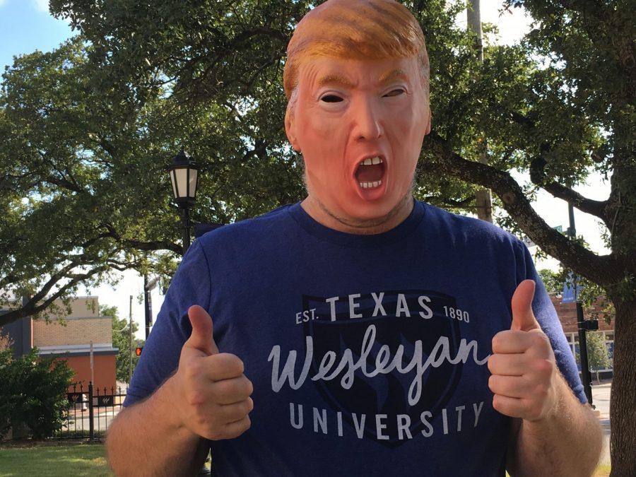 A Wesleyan faculty member Dons a Trump mask to illustrate the universitys interest in the presidential candidate.