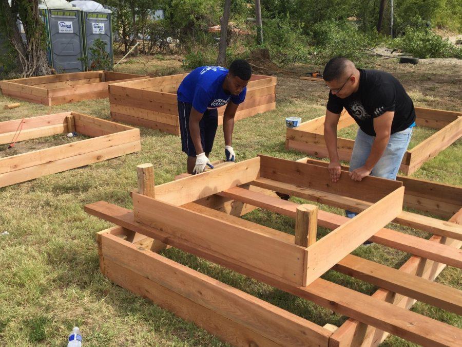 Members of the PolyWes Gardens group work on the new community garden. 
Photo by Akeel Johnson