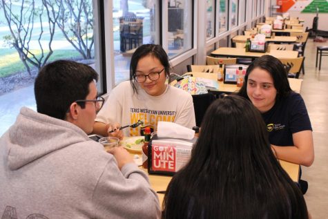 Freshman mass communication major Tina Huynh and other international students eat at Dora Roberts Dinning Hall.