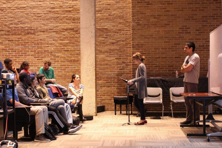 Wesleyan Humanist Organization vice president Mary Collins address debate participants on Tuesday. Behind her is organization  president Nasrullah Sailab. 
Photo by Nicholas Acosta   