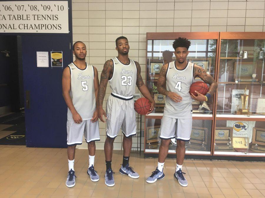 Junior guard Jalil Francois, senior guard Najeal Young, and senior guard Naiel Smith wait outside the gym in Sid Richardson for team pictures.
Photo by Karan Muns