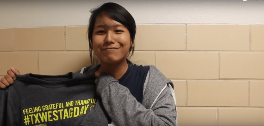 Sophomore Nikita Dhoubhadel shows off one of the Texas Wesleyan Tag Day t-shirts.