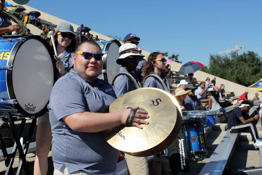 Junior music major Javy Careaga plays the cymbals for the Ram Band during homecoming. Photo by Hannah Onder 