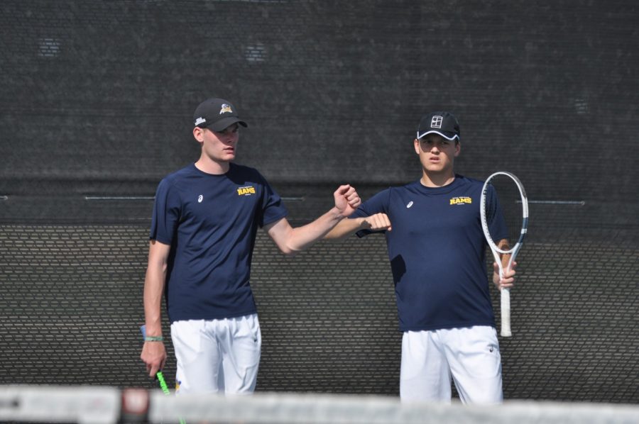 Linus Richter left and Florian Schmitt bump fists during a doubles match against University of the Southwest earlier this month. Photo by Josh Lacy