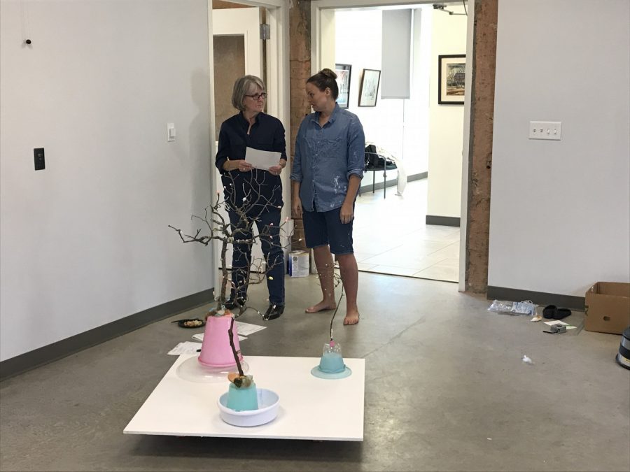 Kit Hall (left) and artist Molly Dierks discuss the names of the pieces in the exhibition at the Bernice Coulter Templeton Art Studio.
Photo by Hannah Lathen