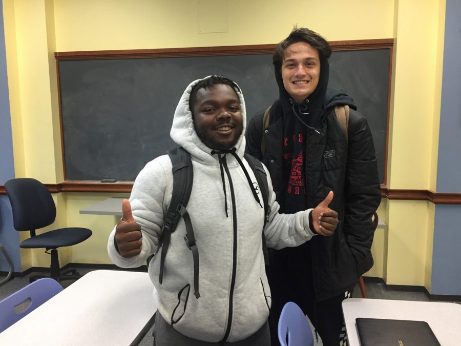 Nicolas Goldsby, freshman business management major, gives the workshop a thumbs up with freshman psychology major Joseph Normandy. 
Photo by Massaran Kromah



