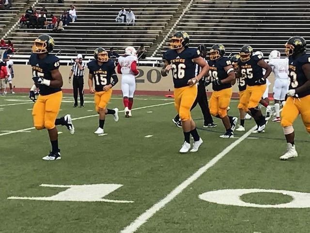 The Rams offense comes off the field after a play against Lyon College. 
Photo by Ashton Willis