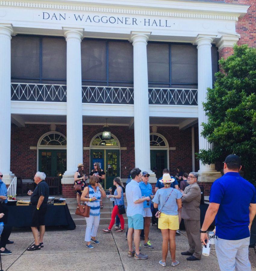 Alumni stop at Dan Waggoner Hall for the Wesleyan Wine Walk on Saturday.
Photo by David Cason