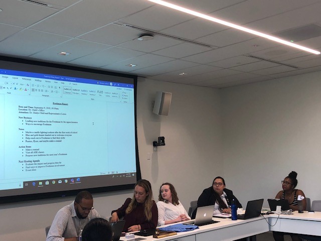 SGA executive officers (left to right) Carlos Mathurin, Alyssa Hutchinson, Lexi Barlow, Karen Duarte-Escobar, and Kierra Glover listen as Meghan Lewis presents her report.
Photo by Arely Chavez