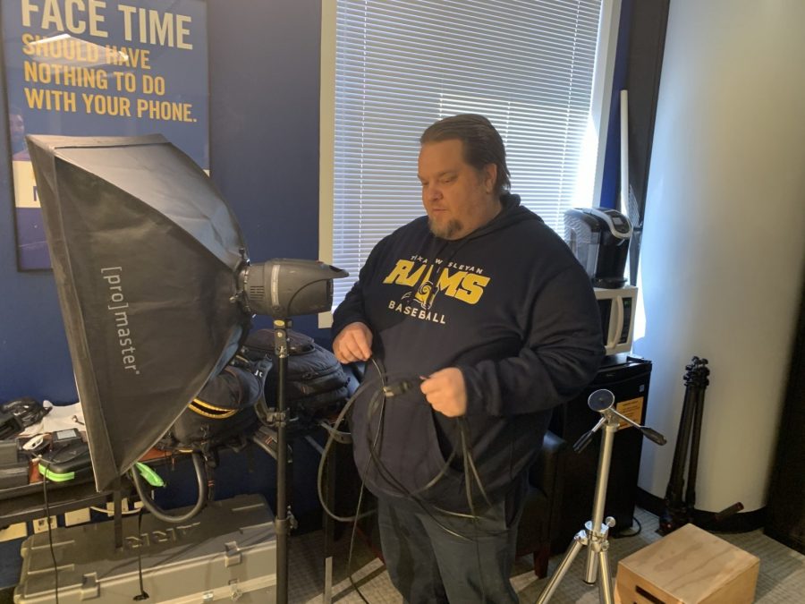 University Videographer and Photographer Chuck Greeson sets up the lighting in his studio while working on a new project.
Photo by Parker Turley