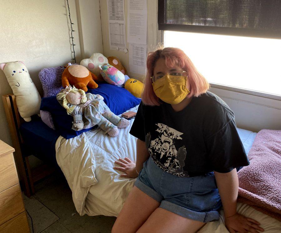 Cindy Flores poses in her dorm room in James C. Armstrong & O.C. Armstrong Hall. Flores’s mom, Maria, and her older brother, Isabel, took turns assisting her with moving in for the fall 2020 semester. Photo by Hannah Onder