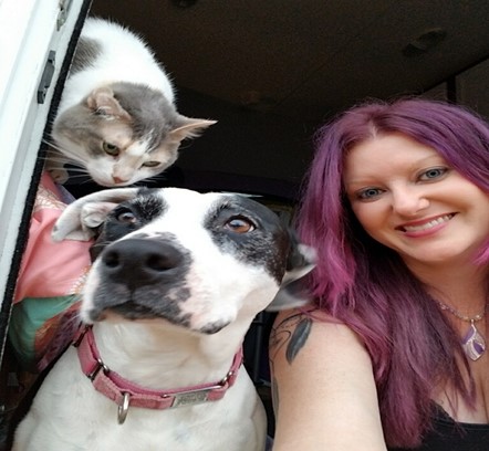 Sociology major Lindsey Bishop poses with her cat, Bella and her dog, Panda. Photo courtesy of Lindsey Bishop