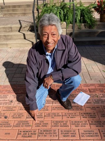 Alumni donor Jorge Vivar poses near his brick which honors his dedication to the school through funding and time allotted to the Alumni Association.