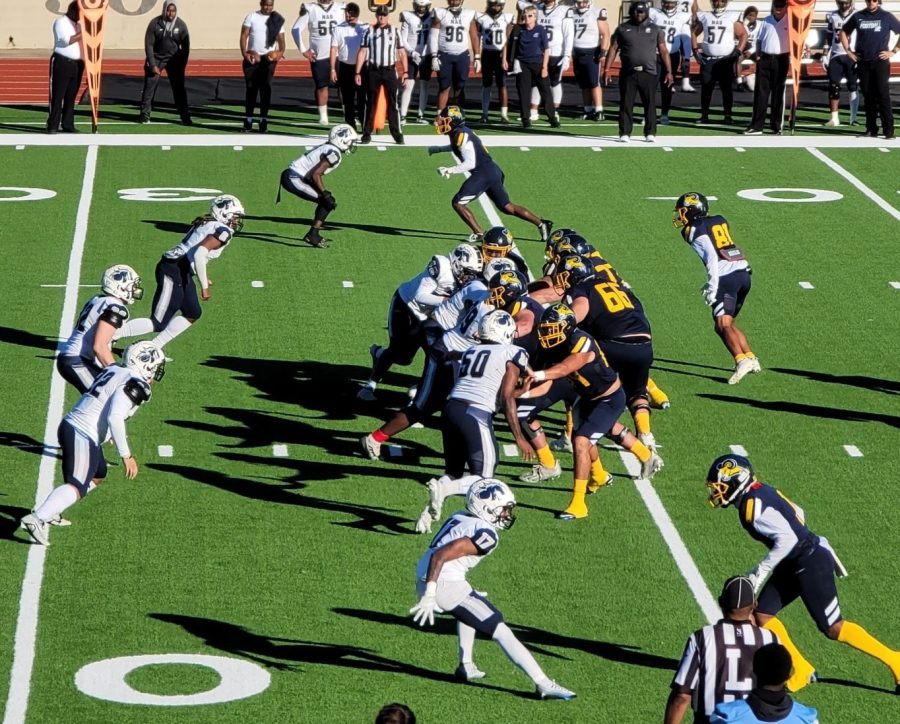 The Rams’ offensive line and the Stallions’ defensive line face off during a play in the third quarter.