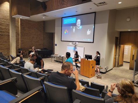 Students and professors relax and conversate while watching a livestream covering the midterms. 