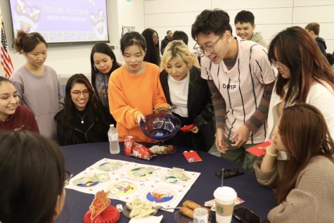 Attendees play a traditional Vietnamese gambling dice game called Bau Cua Ca Cop.