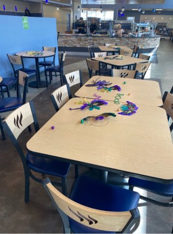 Dora’s Café server Shae Wallace Decorated each table with masquerade mask, bead necklaces, and Rolo's and Reese’s.