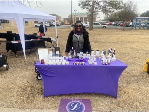 Lauren Harris, founder and owner of Silky Radiance all-natural skincare, greets customers. 