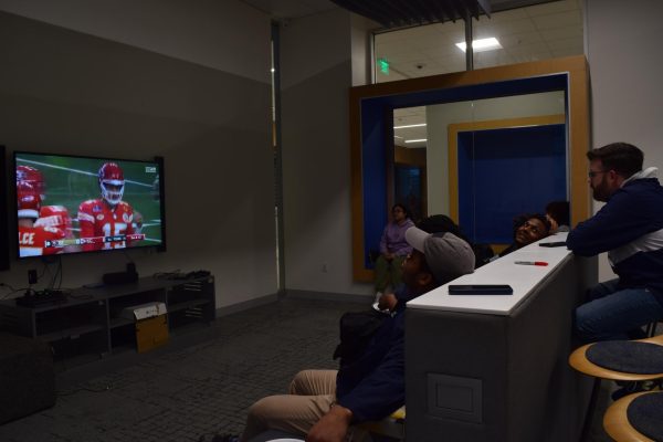 Students watch the big game in the Martin University Center game room.