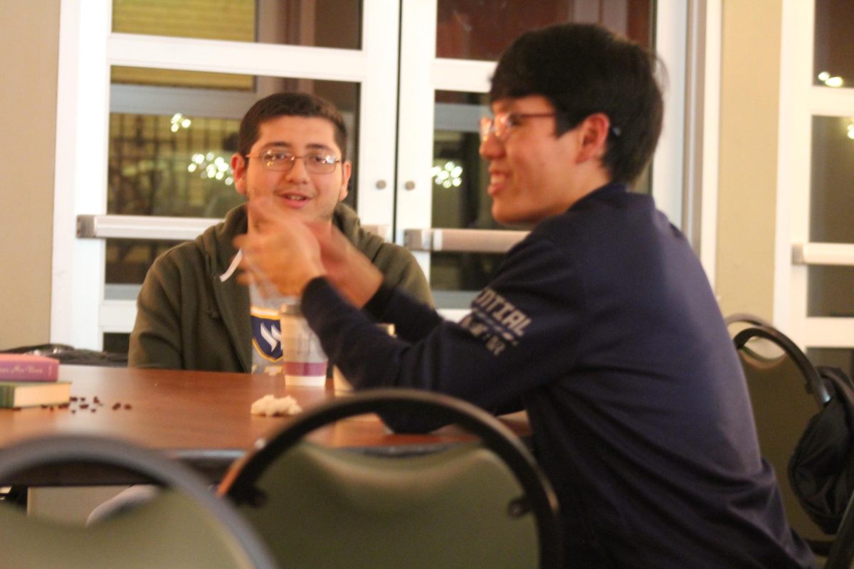Diego Rodriguez and Thai Tran, both first-year psychology and computer science majors, laugh and enjoy themselves after a long week of getting ready for midterms. 