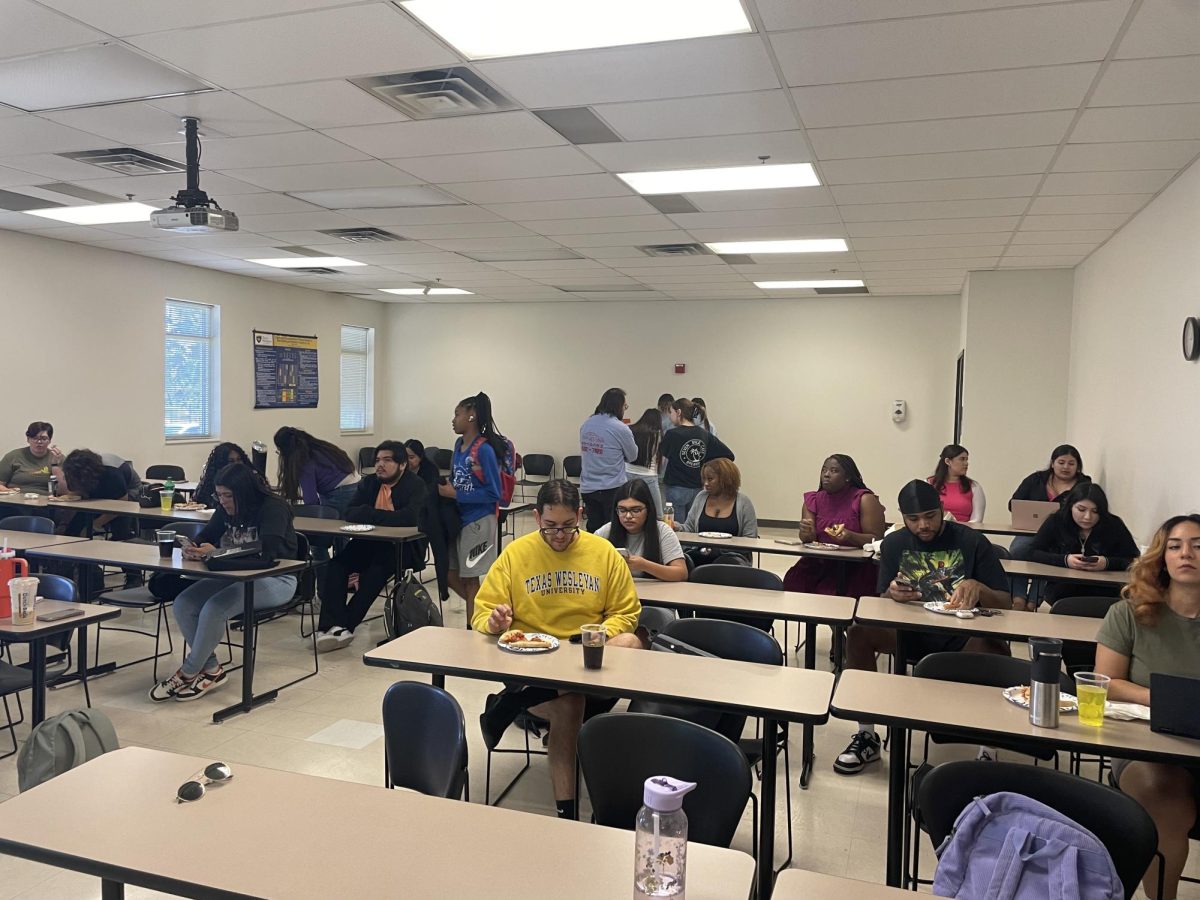 Students enjoy pizza and refreshments as they listen to career advice from guest speaker James Turnage, My Health My Resources (MHMR) of Tarrant County clinical director for disability services.  