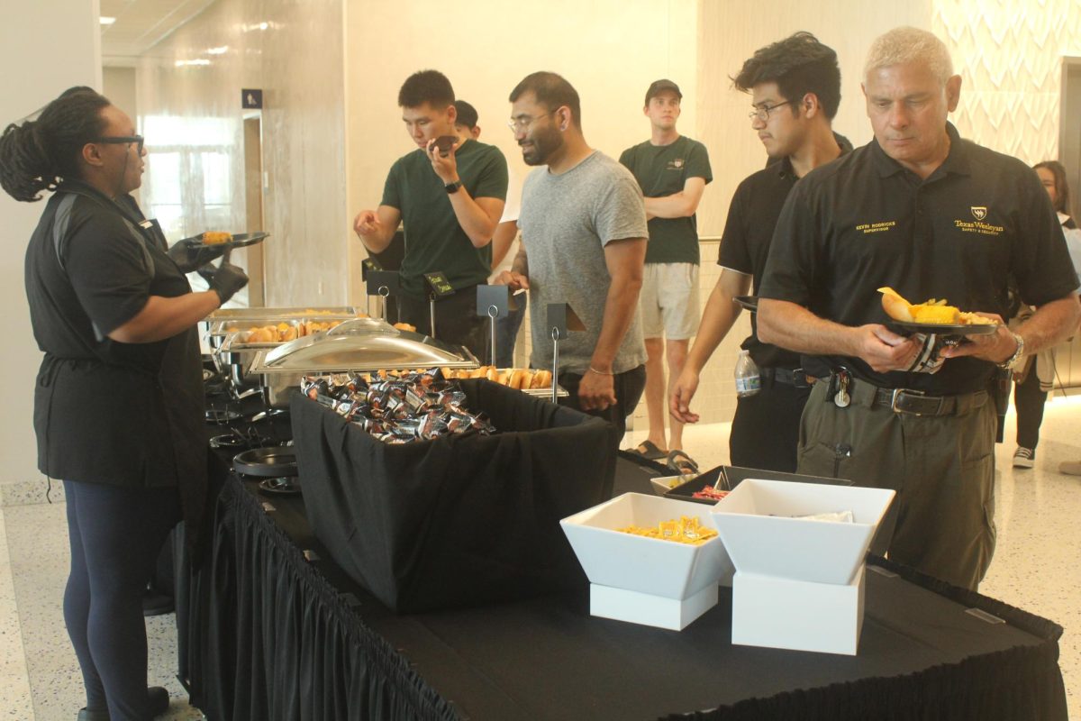 BBQ chicken sandwiches, black bean chipotle burgers, and pulled pork sandwiches with chips are served to all that attended the President’s Picnic on Aug. 2.  