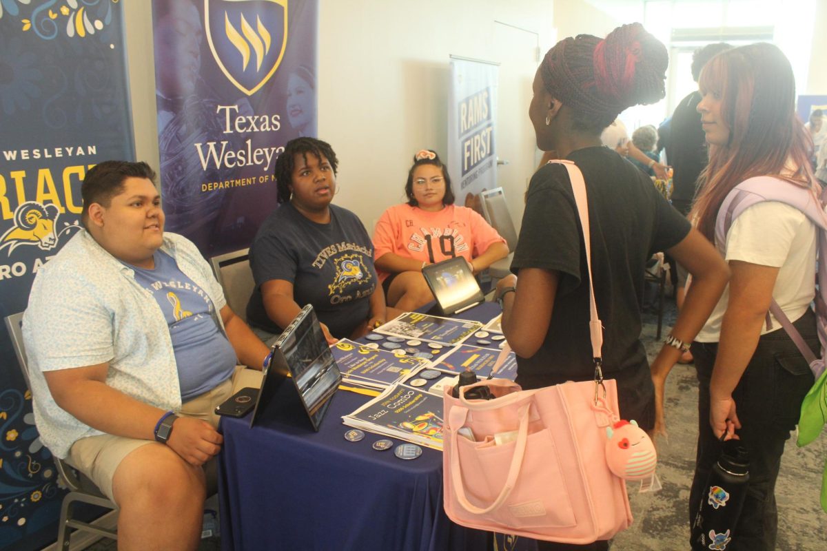 Texas Wesleyan’s mariachi band Oro Azul offers pins to those interested. 