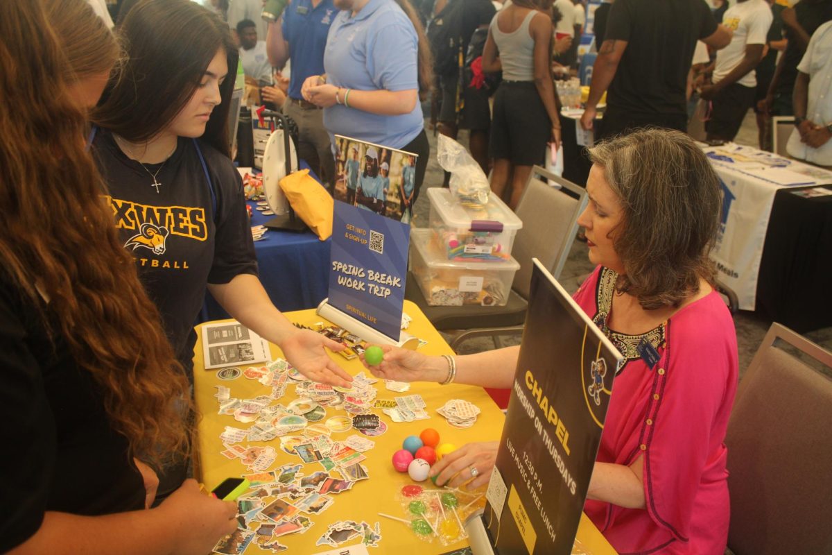 Spiritual Life offers stickers with encouraging quotes and different states, lollipops and lip balm. Dr. Gladys Childs, the Associate Professor of Religion, encourages students to attend worship on Thursday. 