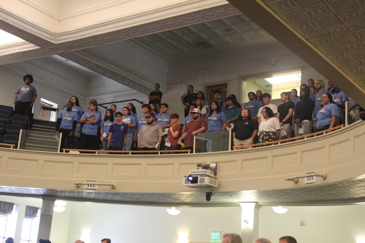 New students show off their new 2024 Convocation T-shirts. 