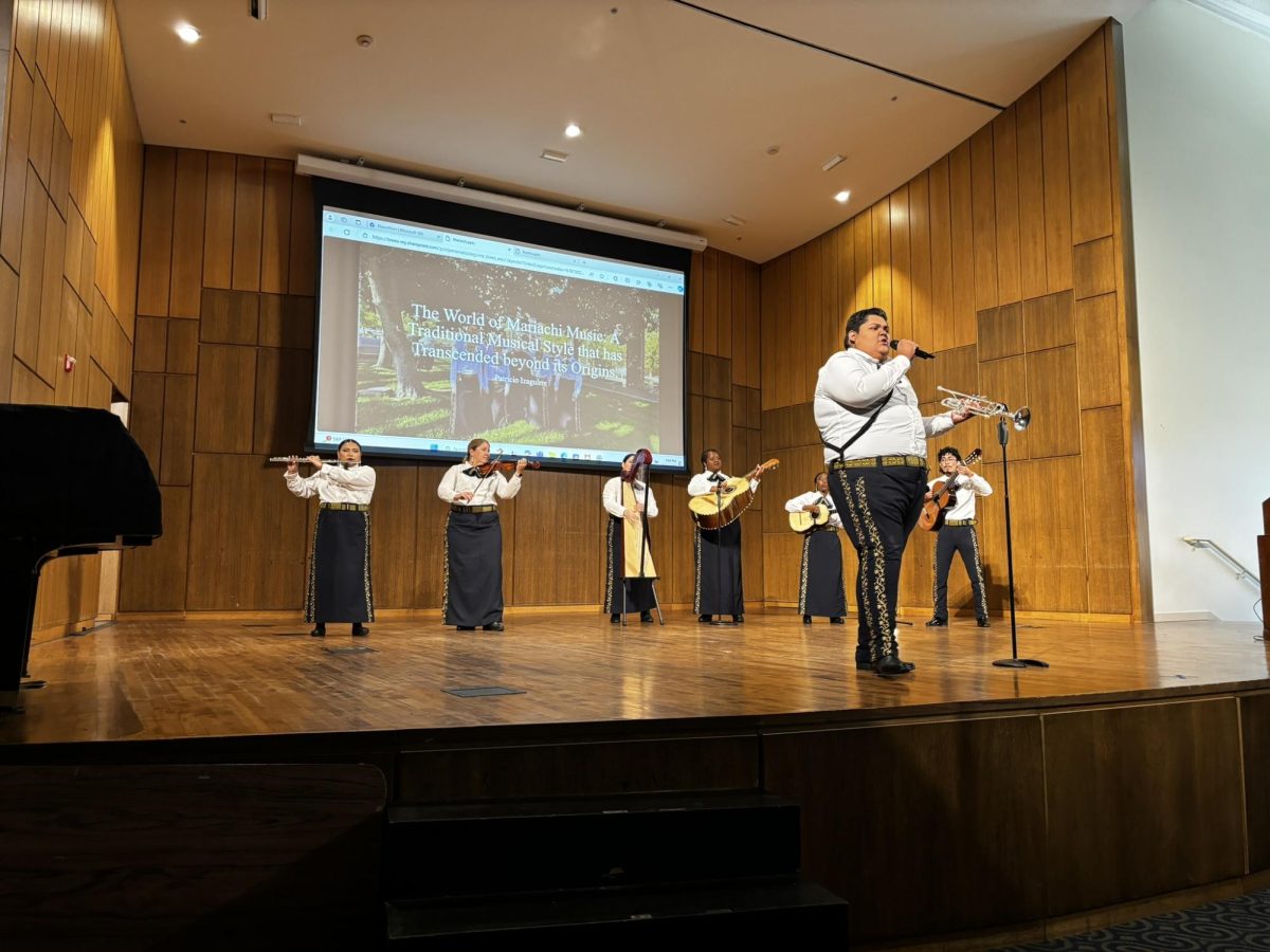 Sophomore vocal performance major Patricio Izaguirre performs with the Mariachi band, Oro Azul, during a Bomba and Mariachi presentation on Sept. 19.