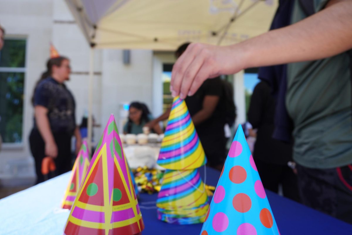 Student affairs bring the birthday energy with free cupcakes and party hats. 