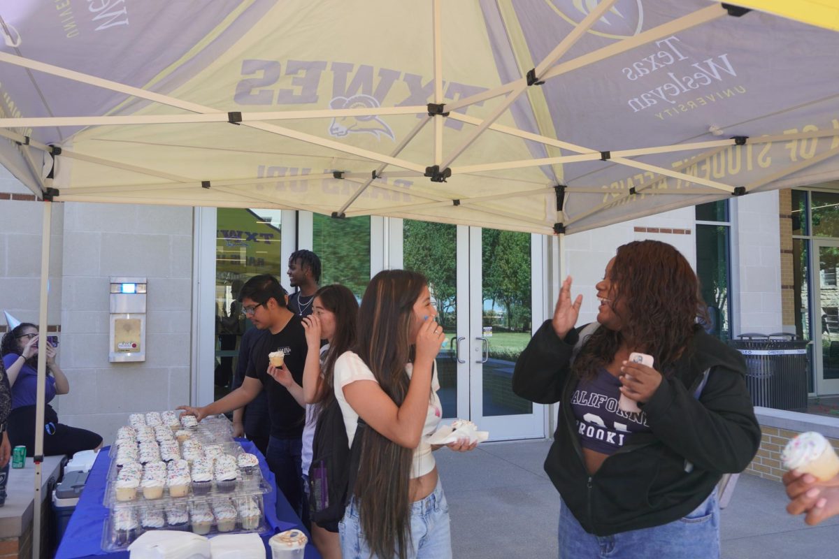 Smiles are shared as students come out to join in the celebrations at the MUC birthday. 