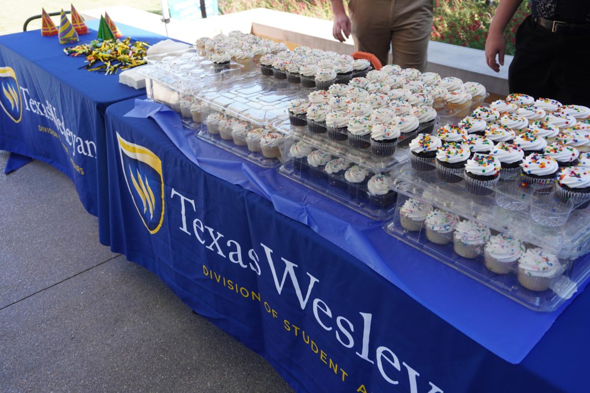 Vanilla and chocolate cupcakes are offered in celebration of the Martin University Center. 