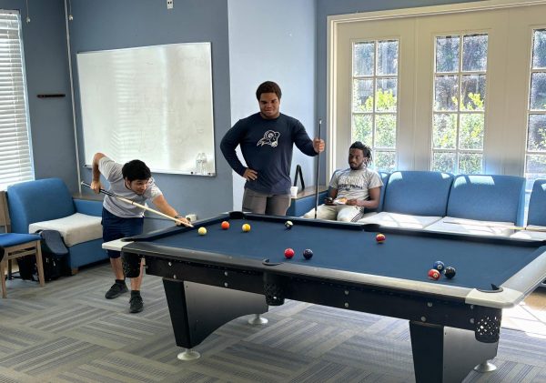 Dominic Garcia, freshmen business analytics major aims to score in a game of pool. “It has been a while since I played pool, but I thought I did better than I would have.” 