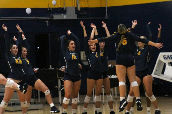 The Rams volleyball team celebrates as their next game is the conference opener against University of Science and Arts in Oklahoma.