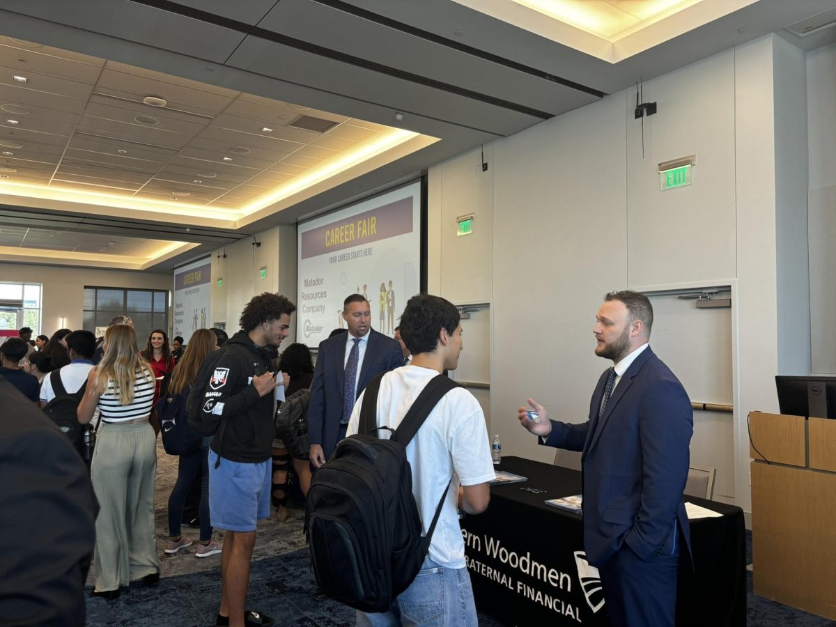 Students explore the Martin Center Ballroom in search of potential employers.