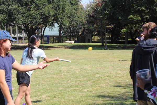 Kayla Nguyen hits the ball on her second attempt at the game. 