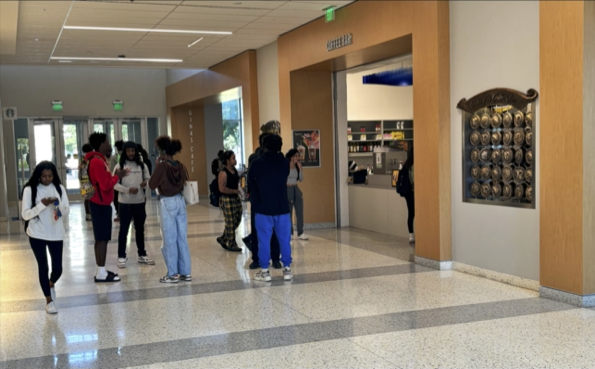 A line snakes from the coffee bar kiosk to the elevators and curves to the nearest walkway inside of the Martin University Center. 