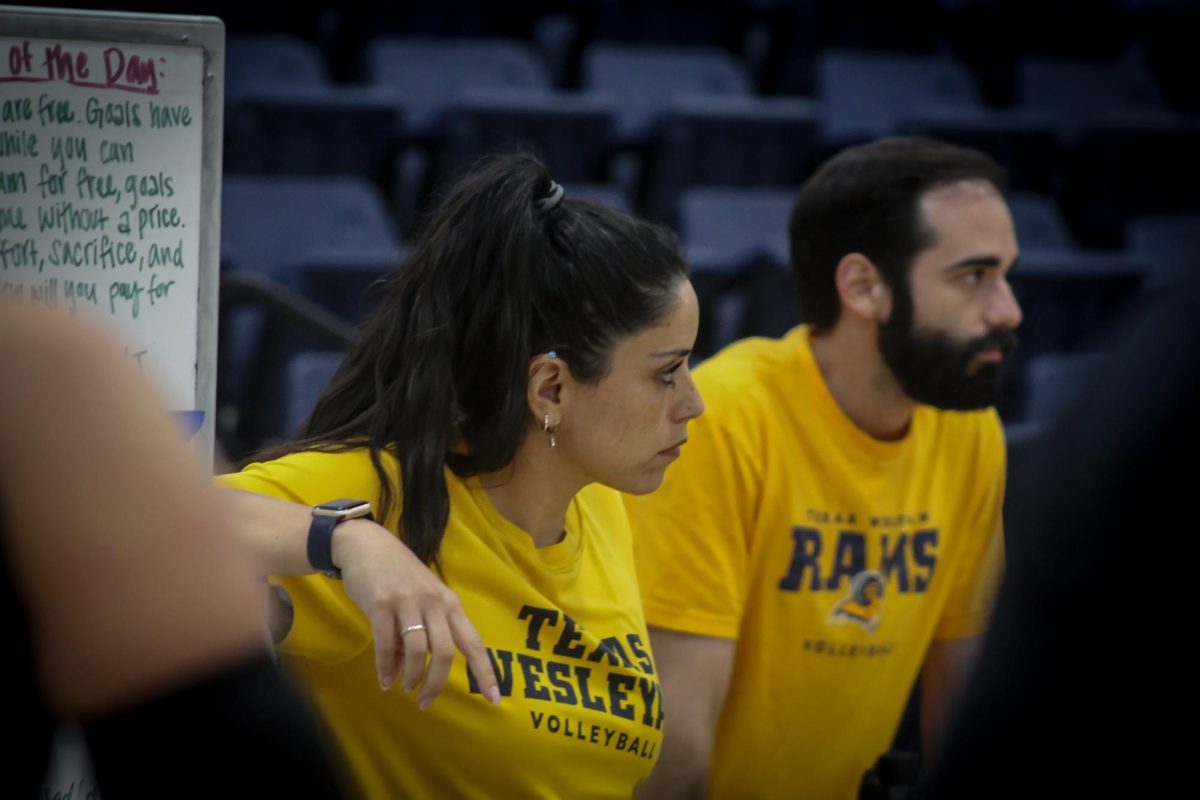 Head coach Aminah Orozco and assistant coach JD Boyd stay focused during practice admire the hard work of the players. The new coaching duo hopes to build a legacy of success on and off the court for Texas Wesleyan volleyball. 