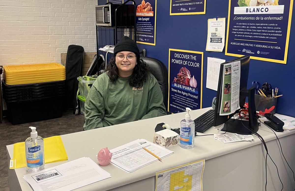 Junior sociology major Gianna Farias welcomes students as they come into the food pantry in spring of 2024. The food pantry is one of the organizations who has received allocated funds from the SGA.