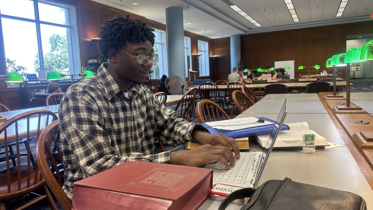 David Ojerinola, sophomore exercise science major, studies at the Eunice & James L. West Library during midterms week.  