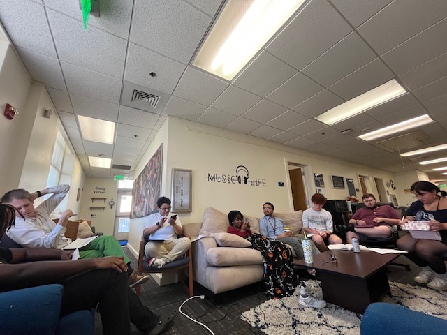 Music Brain Cafe members meet in the Ann Waggoner Fine Arts Building to discuss their musical journeys, successes, and challenges. Photo courtesy of Dr. Bradley Naylor.

 