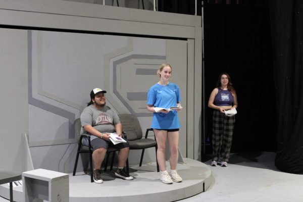 From left, Ian Kooistra as Henry, the daughter’s friend; Lauren Hunt as Natalie Goodman, the daughter; and Peri E. Zachmeyer as the mother, rehearse their roles last week. (Photo courtesy Jacob Rivera-Sanchez)