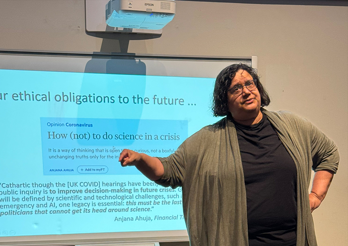 Dr. Monica H. Green address the audience of students and faculty in the Science Lecture Theatre at the McFadden Science Center. 