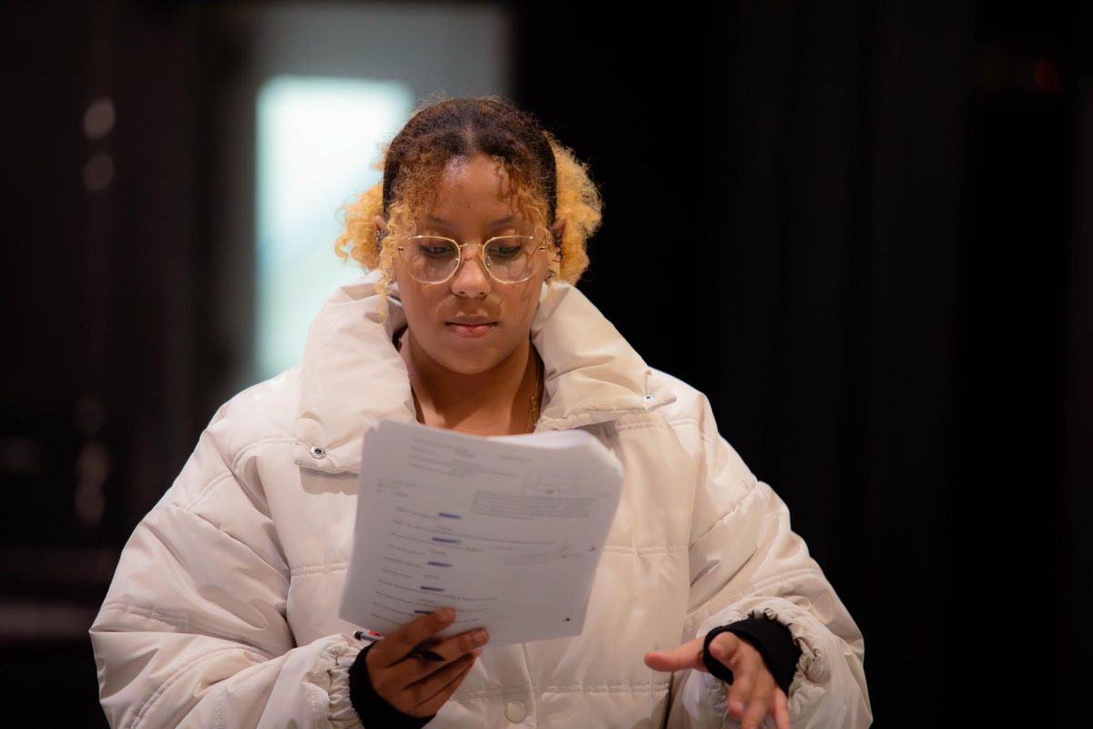 Trinity Chenault, the play's lead, reads through her script during a rehearsal for "Letters from the Library". The production explores untold stories through the power of letters. [Photo courtesy Lauren Hunt]