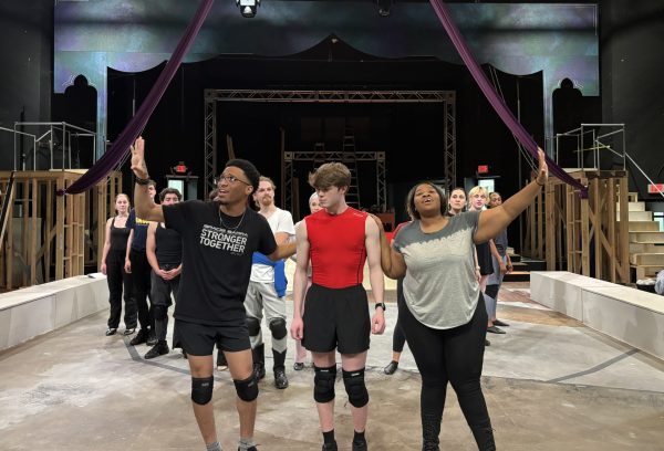 Hunter Heart (center), the play's lead, rehearses a scene alongside other student actors. [Photo courtesy Jacob Sanchez]