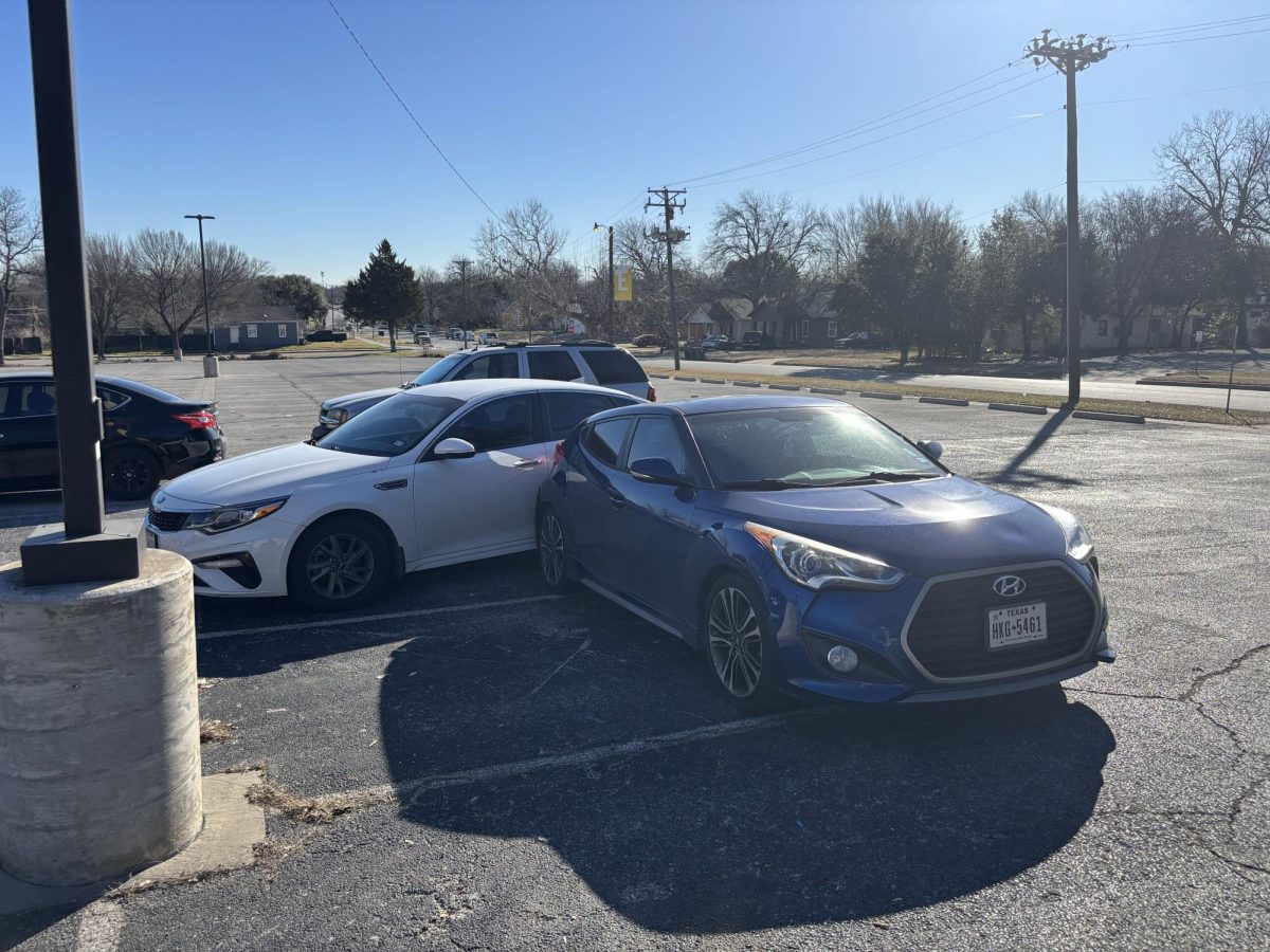 A minor collision between two student vehicles in Lot E highlights the growing safety concerns caused by overcrowded parking and unclear traffic flow.